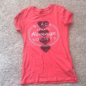 A Vans shirt. Says “Black Hearts Revenge Society”